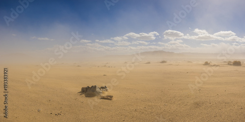 Stone Ring Forms A Fire Pit In A Vast Sand Desert Under The Cloud