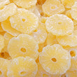 dride pineapple slices closeup, natural yellow background