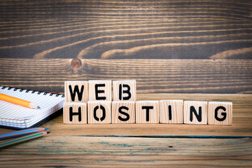 Wall Mural - web hosting. Wooden letters on the office desk, informative and communication background.
