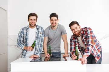 Poster - Portrait of a three smiling male friends celebrating