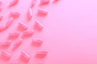 pink pills on pink background top view