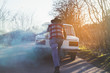 © ADDICTIVE STOCK - Man pushing broken vintage car