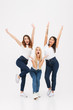 © Drobot Dean - Full length portrait of three happy casual girls