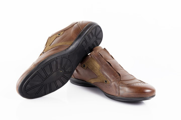 Male brown leather shoe on white background, isolated product, comfortable footwear.