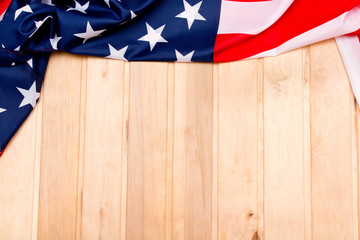 American flag on a light wooden background. The Flag Of The United States Of America. The place to advertise .