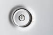 The power button is white. Volumetric white standby-button with shadows.