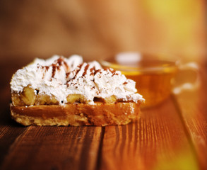 Wall Mural - cake with tea on wooden desk