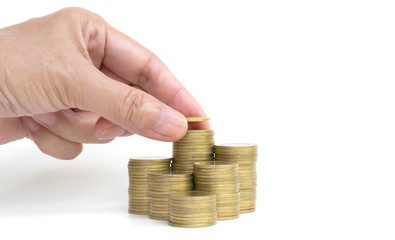 Hand of person with stack coins isolated on white background. Financial analyzing concept.