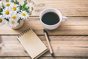 Blank empty notebook, wooden background, view from above, copy space