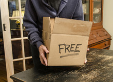 Man With Box Marked Free