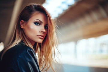 Wall Mural - Beautiful young blonde with long hair posing