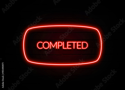 Fotografía Completed neon sign on brick wall background.