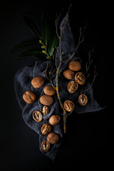 Beautifully presented walnuts on dark slate plate kitchen with napkin table can be used as background