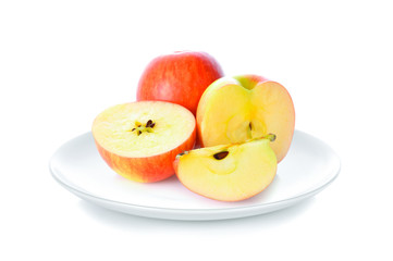 Wall Mural - Apples in white plate on white background