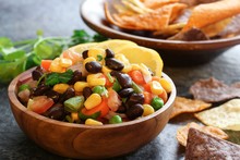 Homemade Black Bean Corn Salsa With Chips Served In A Wooden Bowl, Selective Focus