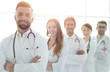 © ASDF - Group of happy successful doctors standing in a row in the hospital