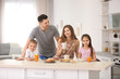 © Africa Studio - Happy family having breakfast in kitchen
