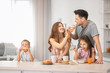 © Africa Studio - Happy family having breakfast in kitchen