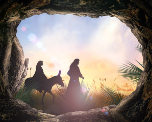 Christmas religious nativity concept: Silhouette mother Mary and father Joseph looking Jesus born in birth manger - 3d illustration