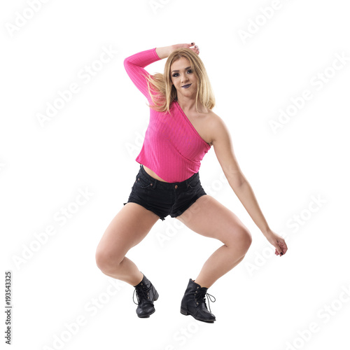 Fotografie, Obraz Flexible crouching blonde woman jazz dancer moving in choreography poses