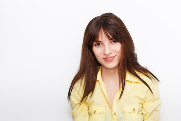 Wall Mural - Emotional portrait of a young beautiful girl on a white background.