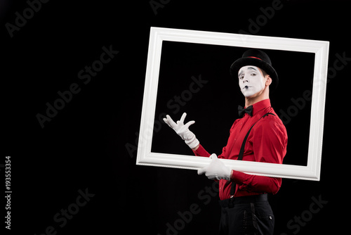 Fotografie, Tablou elegant mime gesturing in frame isolated on black