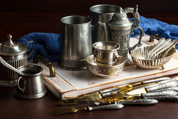 Wall Mural - Old silver dishes with accessories for the kitchen