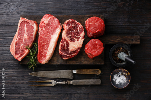Fotomural Variety of Raw Black Angus Prime meat steaks Blade on bone, Striploin, Rib eye,