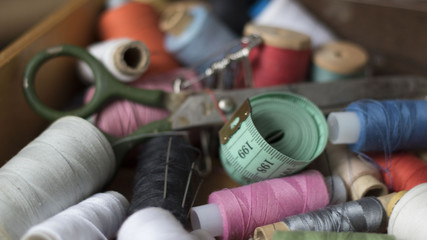 Sewing threads multicolored background closeup