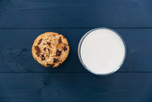 Chocolate Chip Cookies And Glass Of Milk On Dark Background