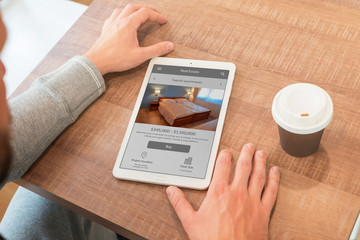 Aufkleber - Real estate agency web site on property agent laptop. Coffee beside.