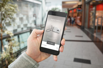 Poster - Shopping technological products with web site on smart phone display. Shopping mall in background.