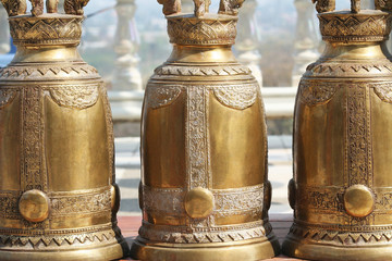 Wall Mural - Old big brass golden bells at the temple in Thailand