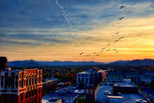 Asheville North Carolina At Sunset With The Blue Ridge Mountains In The Distance.