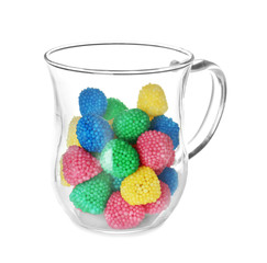 Sticker - Glass cup with colorful candies on white background