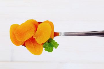 Wall Mural - spoon of dried apricots