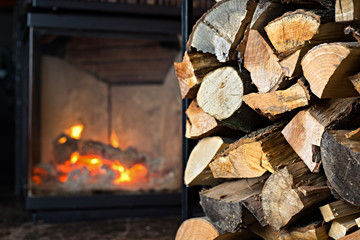 Fireplace with stack of firewoods