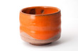 Orange pottery cup