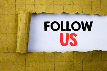 Poster - Follow Us. Business concept for Social Media Marketing written on white paper on the yellow folded paper.