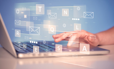 Aufkleber - Hand typing on keyboard with digital tech icons