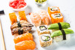 Sushi and sushi roll set on white background.