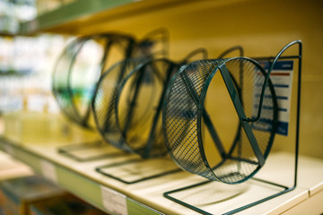 Wall Mural - Pet shop, shelf with hamster wheels, closeup