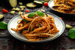 Vegetarian Italian Pasta Spaghetti alla Norma with eggplant, tomatoes, basil and parmesan cheese.
