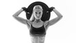 © USM Photography - Fit power athletic confident young woman crossfit exercise with heavy weight barbell plate rising hand Perfect fit athletic girl posing with barbell plate strong lat muscle shoulders biceps triceps