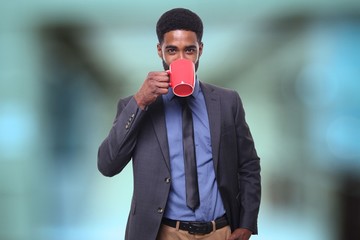 Wall Mural - Young businessman in front of a blurred background