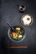Traditional Japanese miso soup with king prawns and rice as top view in a bowl with copy space