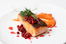 Fried Salmon Steak With Pumpkin Puree, Berry Sauce And Herbs