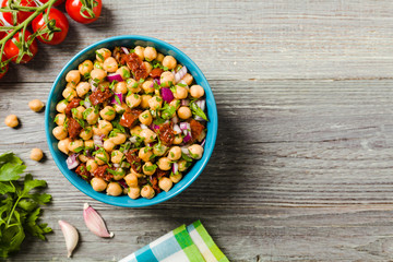 Wall Mural - Chickpeas salad with onion and dried tomatoes.