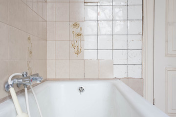 Old bathroom with old vintage dirty  tiles antique 