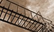 suspended bridge of rusted iron with sepia toned effect
